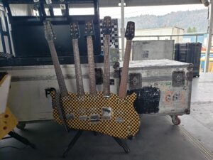 Cheap Trick’s iconic 5-neck guitar being played during a live performance.